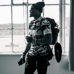 Givenchy Fitting Like Gym Clothes: Cam Newton Wears A Givenchy Camo Flower Paneled Tee-Shirt