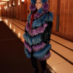 Female Rapper Trina Draped In A Helen Yarmak Hooded Fox Fur Coat & Giuseppe Zanotti Glitter & Crystals Embellished Ankle Boots