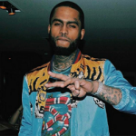 Dave East Wears A Gucci Tiger Print Shell Bomber Jacket & Floral Tee-Shirt With Snakes
