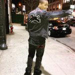 Juelz Santana Outfitted In A Gucci Denim Jacket With Embroideries & Denim Tapered Pants With Panther
