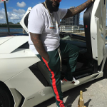 Rapper Rick Ross Wears Gucci & EPTM Green Track Pants