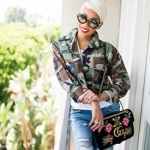 Monica Brown Accessorizes Her Outfit With A Gucci 110th Anniversary GG Marmont Small Dragon Velvet Shoulder Bag