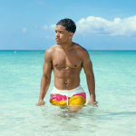 Vacaying In Style: Justin Combs Wears Supreme Split Logo Water Shorts In The Bahamas