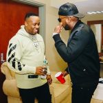 Yo Gotti Spotted In An Off-White Beige And Black Champion Edition Logo Hoodie