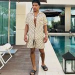 Justin Combs Spotted Poolside In A Gucci All-Over Logo Stamp Shirt , Shorts And Balenciaga Printed Leather Slides