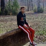 High School Sports: Rodney Carson Jr. Styles In A Gucci Cities Hooded Sweatshirt And Balenciaga Triple S Trainer Sneakers