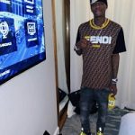 THE HOTTEST RAPPER IN THE GAME: Soulja Boy Wears A Fendi Brown Fendi Mania T-Shirt & Versace Chain Reaction Sneakers