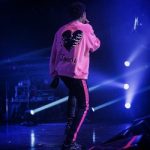 A-Boogie Wit Da Hoodie Performs In An Amiri “Lovers” Skeleton-Heart Cotton Terry Sweatshirt And Broken Track Jeans in Acid Wash Black & Neon Pink