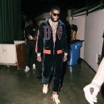 Rapper Gucci Mane Performs In A Dolce & Gabbana Embroidered Logo Sports Jacket & Velvet Track Pants