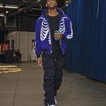 NBA Fashion: Shai Gilgeous-Alexander Outfitted In A Warren Lotas Verified Purple “Real Tree” Carhartt Skeleton Jacket & 99% IS Grey And Black Gobchang Lounge Pants