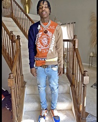 Rapper Polo G Sports A Versace Intarsia-Knit Jumper & Chain Reaction ...