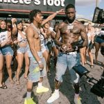 Lil Baby Wears Amiri Crochet-Panelled Distressed Printed Denim Shorts & Alexander McQueen Leather Sneakers At Video Shoot