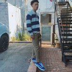Lil Mosey Wears A Gucci Striped Wool Polo With GG Patch And GG Canvas Jacquard Jogging Pants