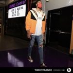 Anthony Davis Dressed In A Gucci Floral Print Shell Hooded Jacket & Off-White Futura Atoms T-Shirt