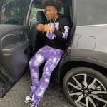 Mikey Williams Wears A Never Broke Again Retro Baby Black Purple Hoodie, Valabasas Stacked Aerglo Purple Jeans And Nike Dunk Low Retro White Black Sneakers