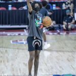 Jalen Green Styles In A BATHING APE® Shark-Print Track Shorts & adidas Red Blackburn Suede Sneakers