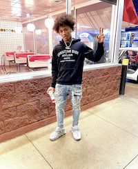 Mikey Williams Wears A Christian Dior Atelier Hoodie, Purple Brand P002 Mid  Rise Slim Worn Jeans And Versace Chain Reaction Sneakers - Donovan Moore  Fashion Book