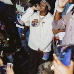 Rapper 42 Dugg Performs In A Travis Scott Cactus Trails Half-Zip Sherpa Hoodie, Merch McDonald’s Smile Brown Sweatpants And Nike Air Max 270 React Sneakers