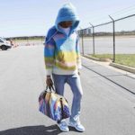 Lil Baby Spotted In A Celine Heavenly Day Marcelo Lavin Collaboration Baja Jacquard Hooded Sweatshirt, Gallery Dept. Stonewashed Flared-Leg Blue Jeans And Bape Sta Low Blue Sneakers