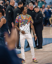 NBA Player Ja Morant Spotted Courtside In A Louis Vuitton Colorful White T-Shirt, Ollie Yellow Multicolor Sneakers And Serenede Everest Peak Jeans