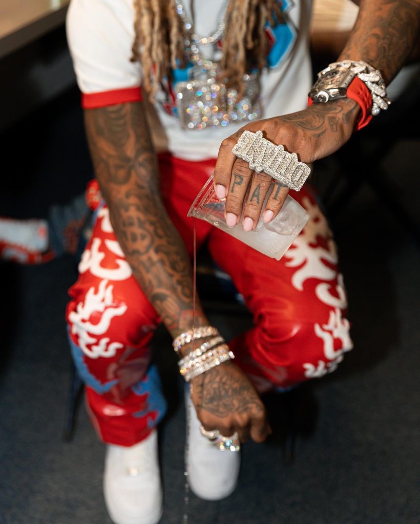 Lil Durk Wearing a Chanel Speckled Beanie & Louis Vuitton Graffiti Tee