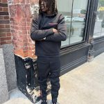 Jameson Williams Posed In A Prada Sweatsuit And Air Jordan 4 “Bred” Sneakers