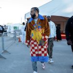 French Montana Performs In A KidSuper Fell In Love With A Dancer Faux Fur Coat, Amiri Mx1 Distressed Light Blue Skinny Jeans And Louis Vuitton × Nike Air Force 1 Low White Red Sneakers
