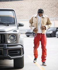 Fashionable Baller Shai Gilgeous-Alexander Wears A Bottega Veneta Long Sleeve Cotton Twill Jacket & Nike Air Jordan 1 ‘Black Toe’ Sneakers