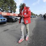 NFL Player Deebo Samuel Color-Coordinates A Supreme x New York Yankees GORE-TEX 700-Fill Down Jacket With Louis Vuitton × Nike Air Force 1 Low White Red Sneakers
