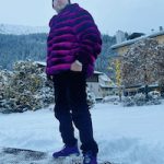 Fat Joe Wears A Fuchsia Chinchilla And Air Jordan 6 Purple Fraternity PE Sneakers At Ski Resort In Switzerland