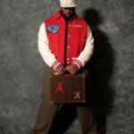 Davon Godchaux’s Louis Vuitton × Yayoi Kusama Psychedelic Red Blouson Jacket And Monogram Canvas Suitcase