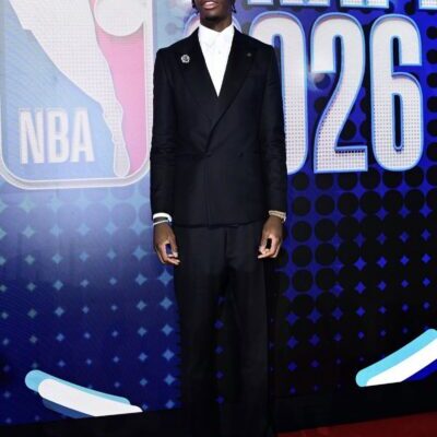 Man in black suit on NBA Draft carpet